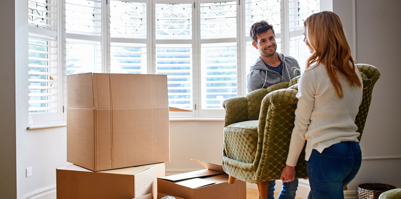 couple moving a chair